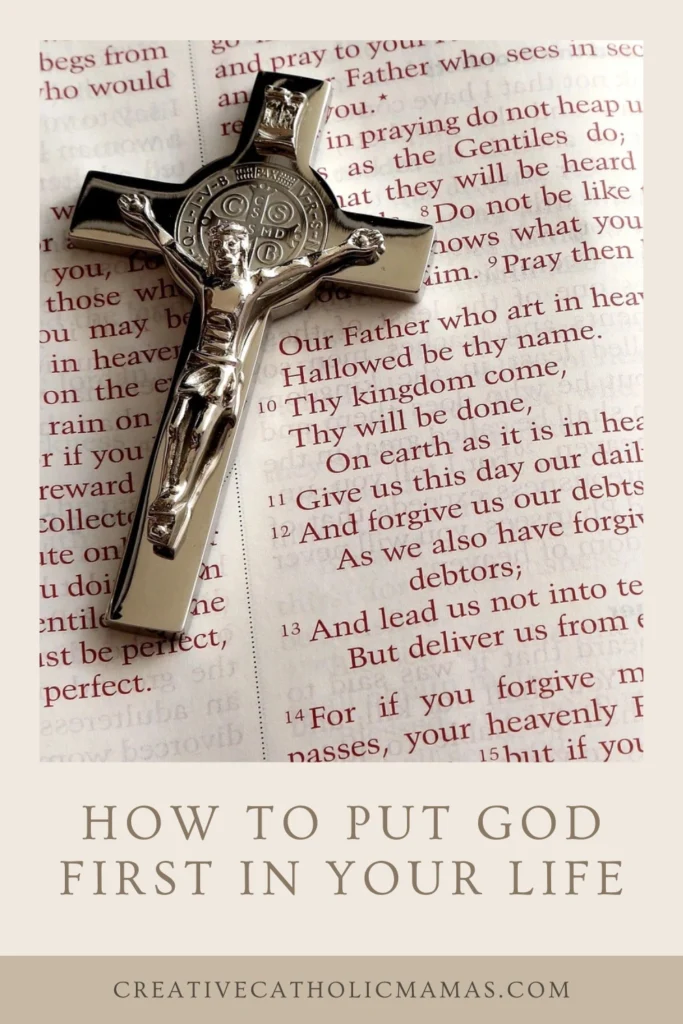 Silver crucifix resting on an open Bible displaying the Lord’s Prayer, symbolizing daily faith and surrender to God’s will.