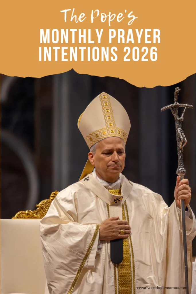 Pope holding a crucifix during Mass, representing the Pope’s monthly prayer intentions for 2026