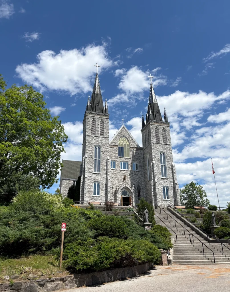 Exterior view of Martyrs' Shrine in Midland, Ontario on a sunny day.