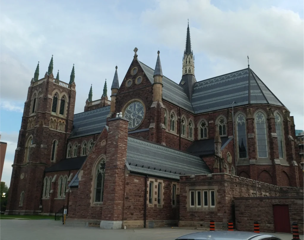St. Peter's Cathedral Basilica in London, Ontario under cloudy skies.